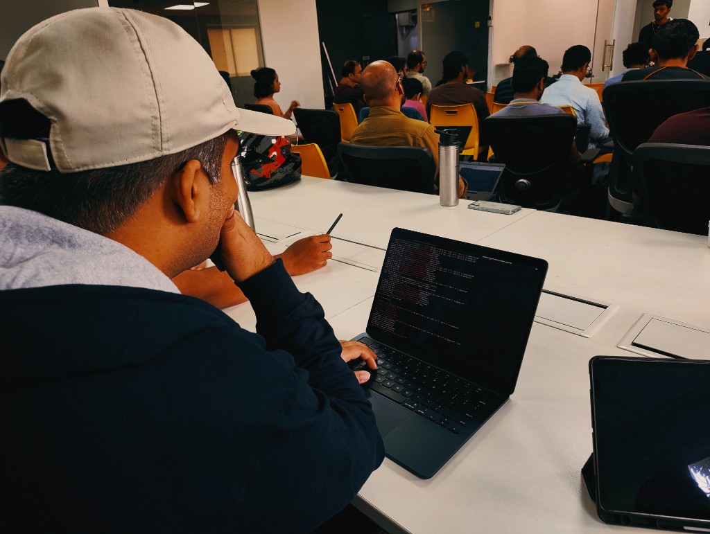 Attendee working on command-line exercises during the meetup