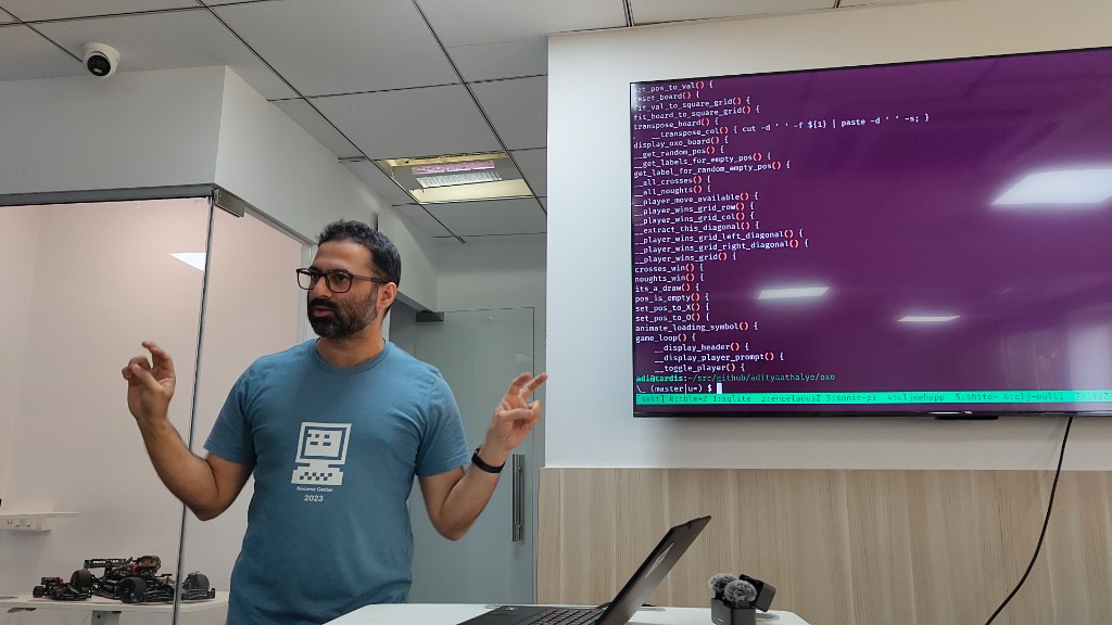 Speaker presenting a terminal workflow demo during Episode 1