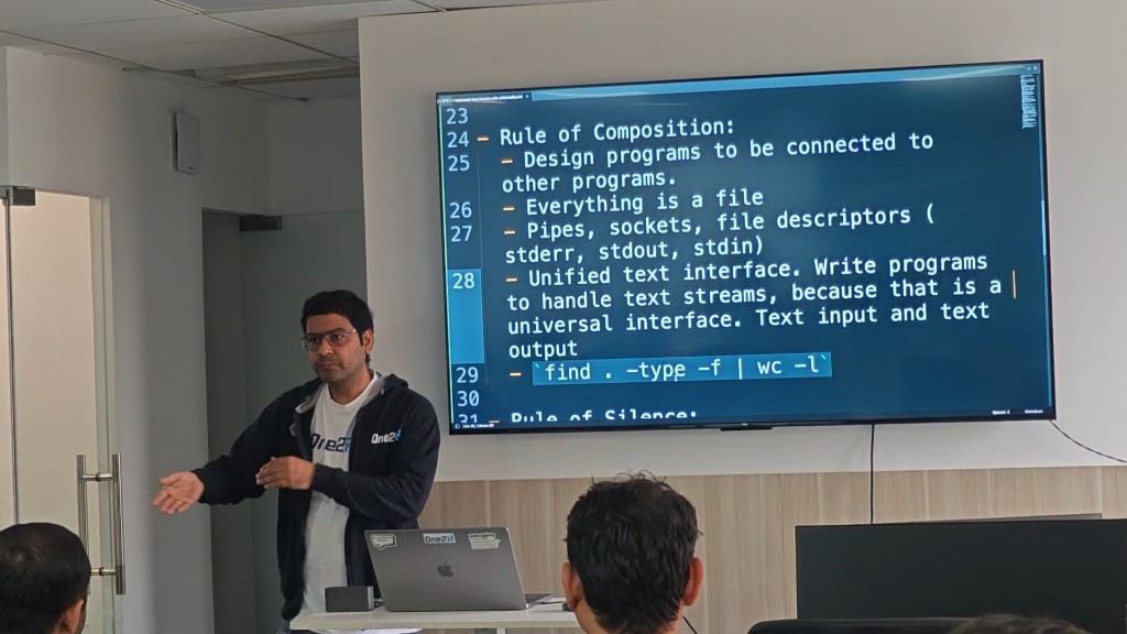 Speaker presenting UNIX composition principles and command-line ideas