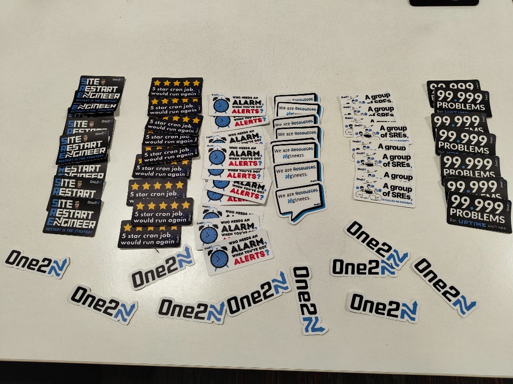 One2N and SRE themed stickers laid out for attendees
