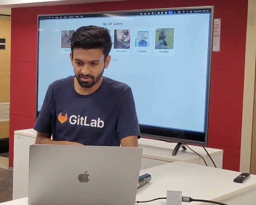 Presenter demoing a project with a laptop and external display