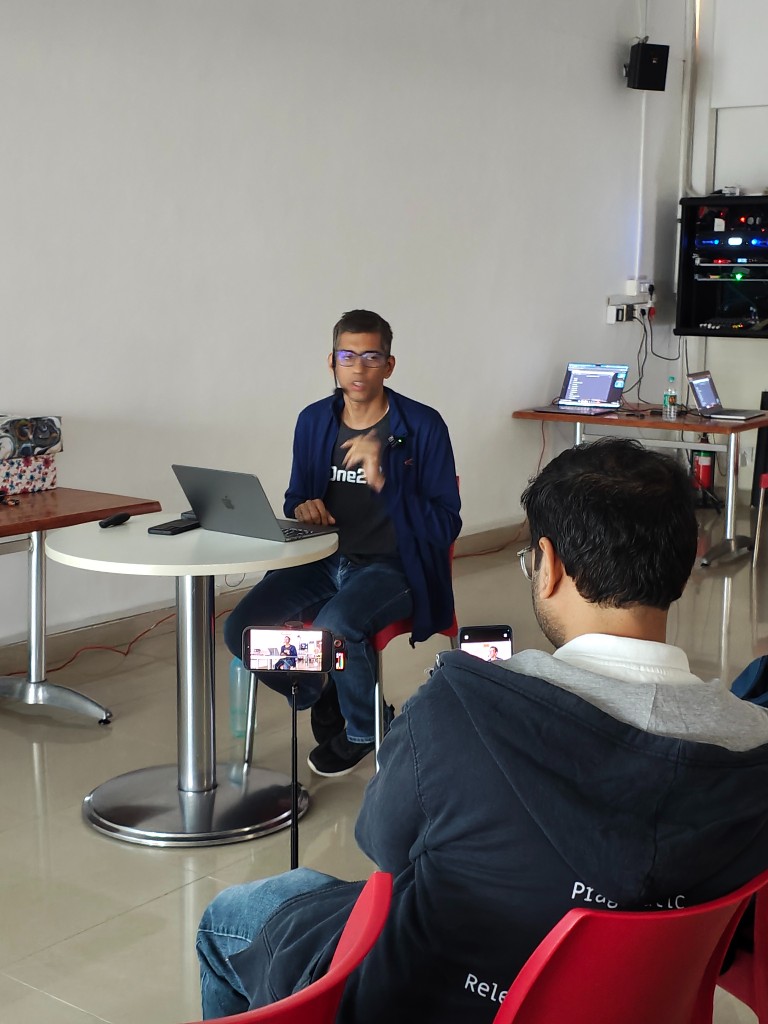 Speaker presenting while attendees record the session on phones